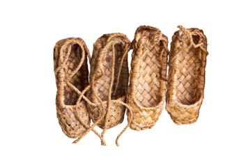 Russian bast shoes - lapti knitted from bark, isolated on a white background