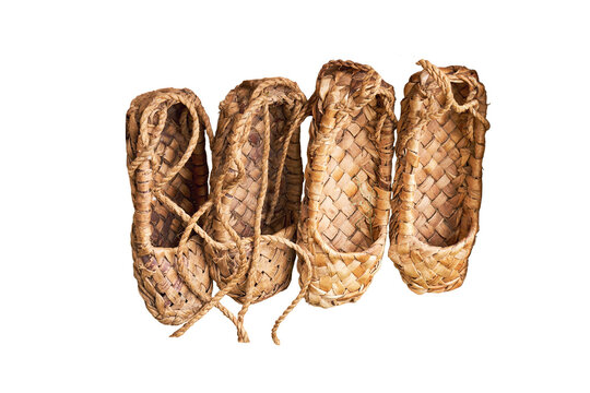 Russian bast shoes - lapti knitted from bark, isolated on a white background