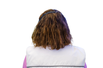 Rear view of a young woman working in a call center, isolated on white background.