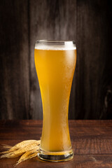 Glass full of German wheat beer.