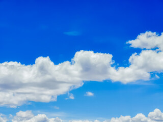 Fototapeta premium Sunny day with blue sky and some clouds, feeling of tranquility and relaxation