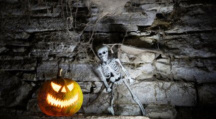 scary Halloween background with Jack'o'lanterns and skeleton