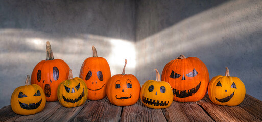 scary funny Halloween pumpkins on wooden table