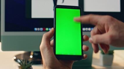 Closeup mockup cellphone scrolling man finger. Businessman hand holding phone