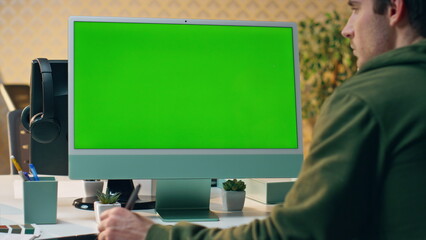 Focused artist staring green screen creating tablet close up. Designer working