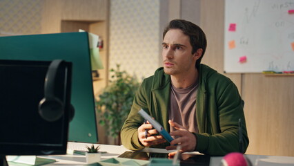 Stressed man video calling computer office. Businessman talking in raised tone
