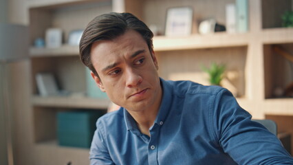 Overworked freelancer sipping coffee workplace closeup. Man taking eyeglasses on