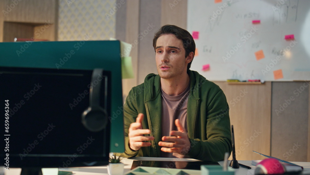 Wall mural relaxed specialist greeting display computer at video call. man opening notebook