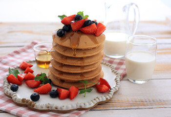 Pancakes with Berries and Maple Syrup for Breakfast