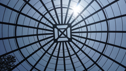 view inside a large aviary dome with curved steel in the form of dome