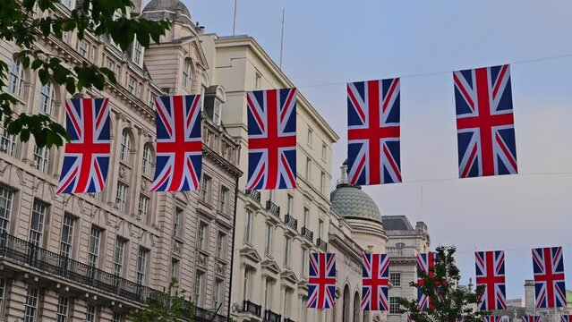 Union Jack flag decorations strung above the streets of London,handheld video