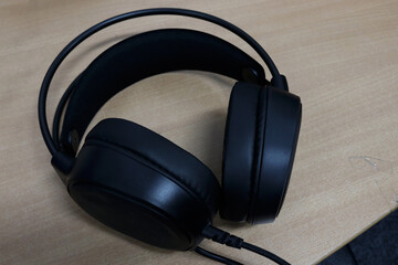 Fototapeta na wymiar Photo of black earphones for listening to music