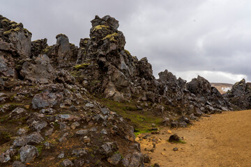 Laugarhaun lava field, hiking to the summer of Mt. Brennisteinsalda in Landmannalaugar, a location in Iceland's Fjallabak Nature Reserve in the Highlands.  
