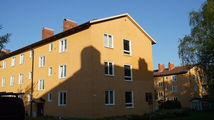 Fototapeta na wymiar Urban house with a shadow