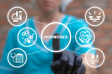 Doctor or laboratory assistant using virtual touch screen presses word: HORMONES. Healthcare...