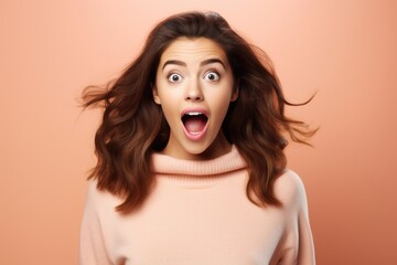 Surprised woman on a plain background. Facial expression. - obrazy, fototapety, plakaty