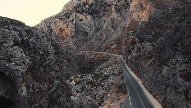 Asphalt road through Kourtaliotiko Gorge, aerial view, Crete, Greece. High quality 4k footage