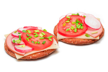 Crispy Cracker Sandwiches with Tomato, Sausage, Cheese, Green Onions and Radish - Isolated on White. Easy Breakfast. Diet Food. Quick and Healthy Sandwiches. Crispbread with Tasty Filling - Isolation