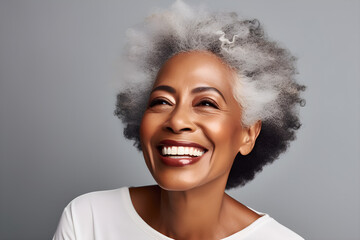 Smiling black adult woman touch face with smooth healthy skin. Open healthy smiling beautiful aging mature woman with white teeth. Beauty, dental and cosmetics skincare advertising concept - obrazy, fototapety, plakaty