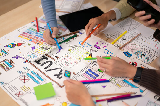 Close up view of young professional UX UI designer discussion on their project in the meeting room.