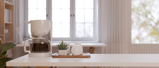 Fototapeta na wymiar White minimal coffee table with coffee machine and coffee cup on the table.