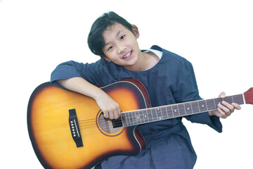 cute Thai girl happily plays the guitar 