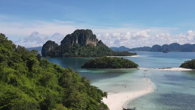 Ascending aerial of famous sandbar connecting tropical islands, Koh Tup, Krabi