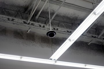 Department Store Security Camera and Linear LED Lights on Ceiling