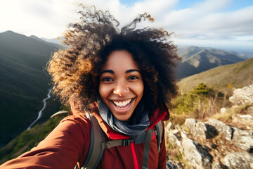 Young black woman taking selfie portrait hiking mountains - Happy hiker on the top of the cliff...
