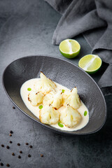 aesthetic cauliflower in white tahini sauce with lime
