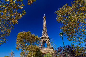 Eiffel Tower with sunny blue sky in Paris, France