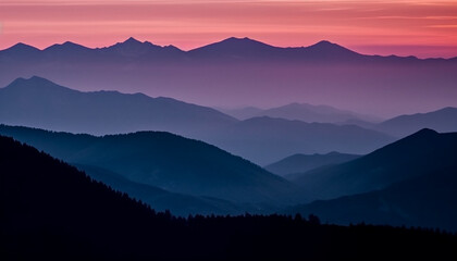 The majestic mountain range silhouetted against the tranquil sunset sky generated by AI