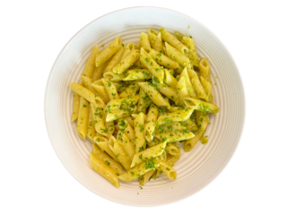 An isolated bowl of pesto pasta against a blank background - top view