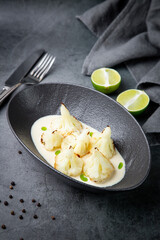 aesthetic cauliflower in white tahini sauce with lime
