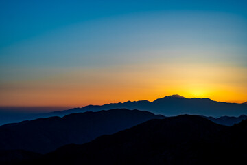Sunset on the top of a hill on Joshua Tree National Park in California, United States