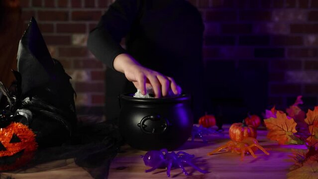 Spooky shadowy figure performing a Halloween magic trick