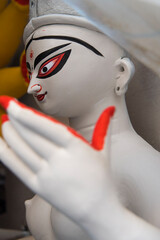 Face of Hindu Goddess idol Durga with use of selective focus 