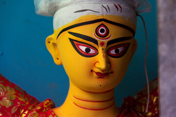 Unfinished idol of Hindu Goddess Durga with use of selective focus 