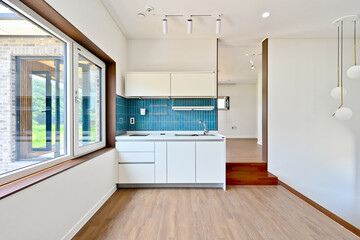 Fototapeta na wymiar Changing your kitchen tiles to teal will make your kitchen feel fresher