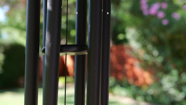 Wind chimes outside in summer in a backyard 