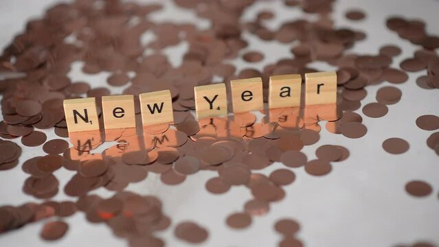 background with shiny confetti and the inscription New Year
