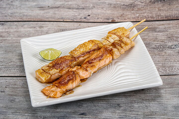 Grilled salmon skewer with sauce