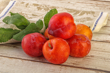Red juicy raw plum heap