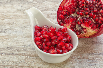 Ripe red Pomegranate seeds in the bowl