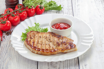 Grilled pork steak with ketchup