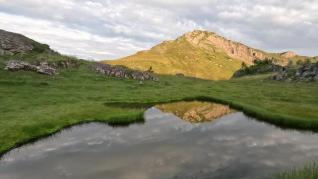Pan Right Wide - Beautiful Mountains and Mirror Reflection in the Water of Alpine Lake