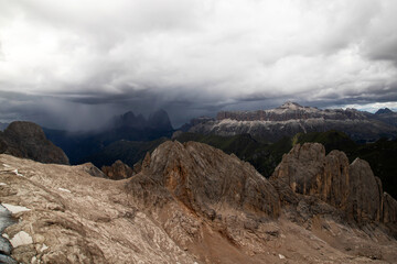 Fototapeta premium Dramatic sky and storm over the the three peaks of the Sassolungo (Langkofel) in the Dolomites, Italy.