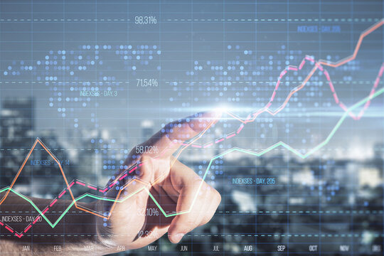 Close up of male hand pointing at creative business graph with index and grid on blurry city background. Stock market and financial statistics concept. Double exposure.