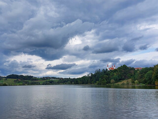 Fototapeta na wymiar lake near Church of the Holy Trinity in Slovenske Gorice. Overcast. Slovenia
