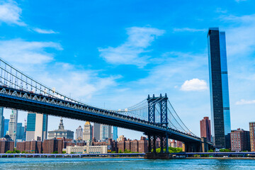 New York City, USA - May 12, 2023: Crossing east river. manhattan bridge in new york. architecture of historic bridge in manhattan.